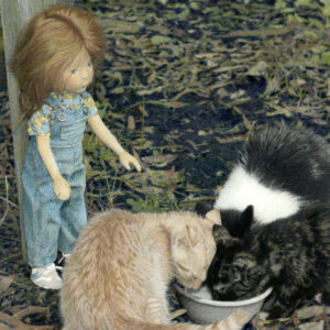 wooden doll Feeding Kittens