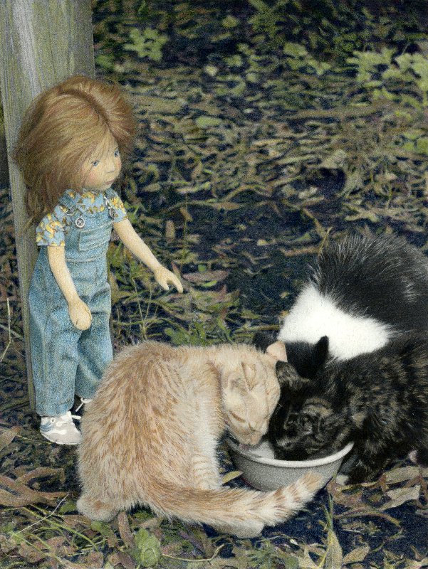 wooden doll Feeding Kittens